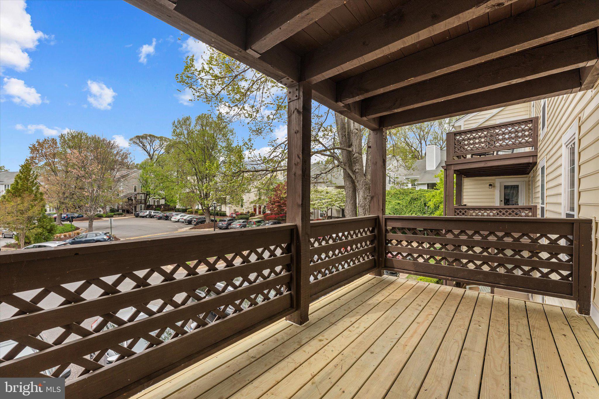 10066 Oakton Terrace Road, Unit 10066 Oakton, VA 22124 - Photo 26 of 27 a view of a balcony with wooden floor