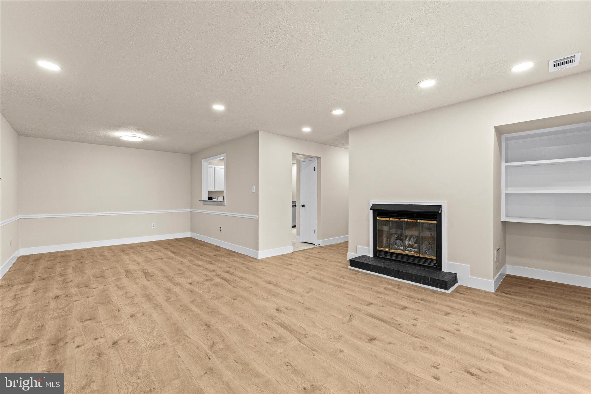 10066 Oakton Terrace Road, Unit 10066 Oakton, VA 22124 - Photo 4 of 27 a view of empty room with a fireplace