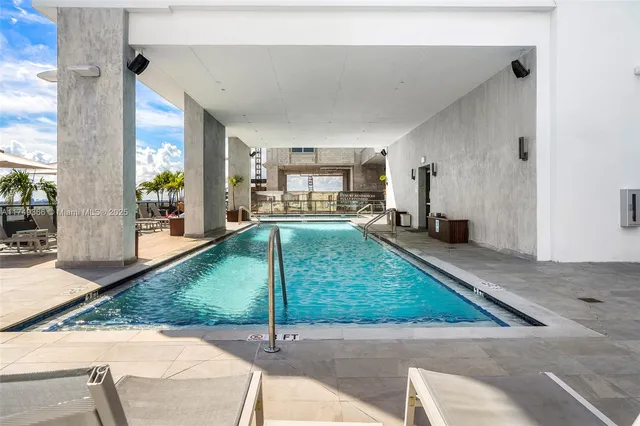 a view of a hall way with furniture