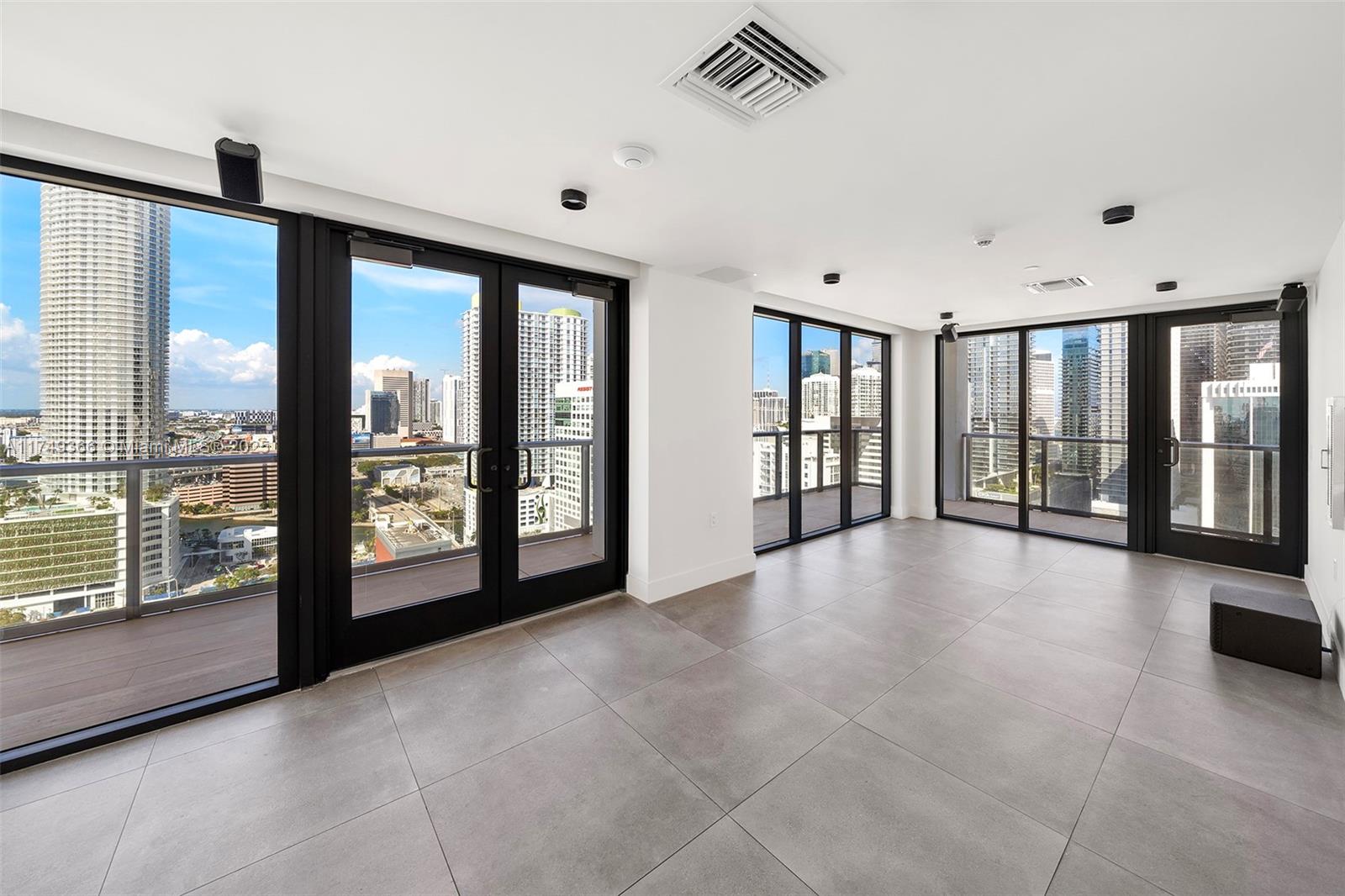 229 Southwest 9th Street, Unit 208 Miami, FL 33130 - Photo 21 of 22 a view of an empty room with windows