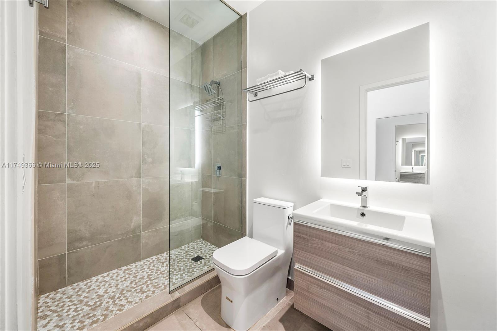 229 Southwest 9th Street, Unit 208 Miami, FL 33130 - Photo 3 of 22 a bathroom with a sink a toilet and shower