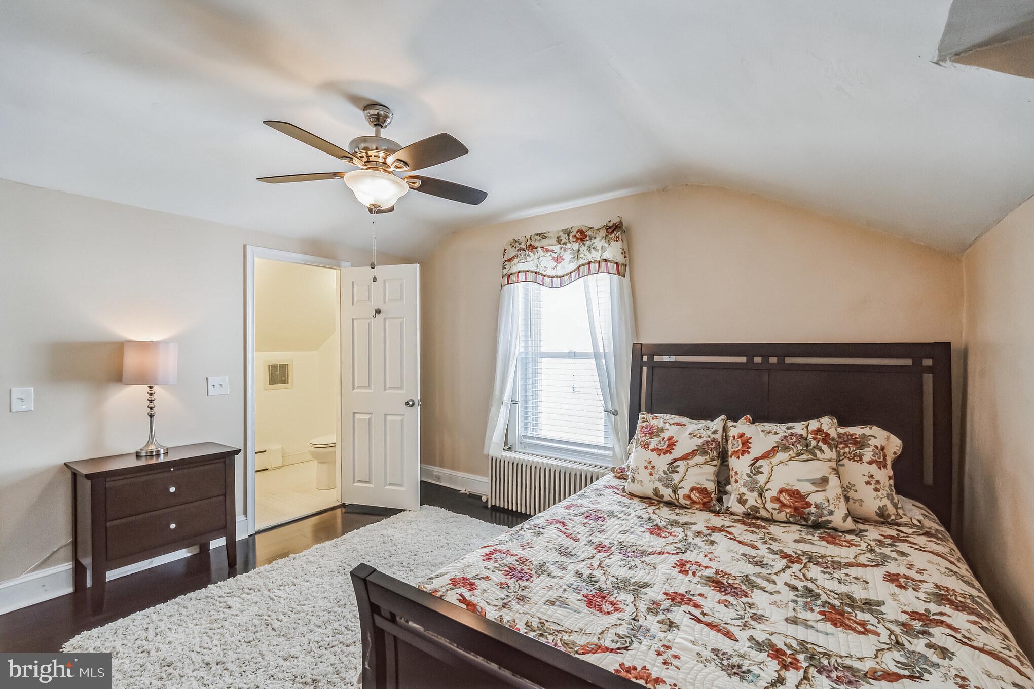6774 Ridge Avenue, Unit 2 Philadelphia, PA 19128 - Photo 12 of 15 a bedroom with a bed and a dresser