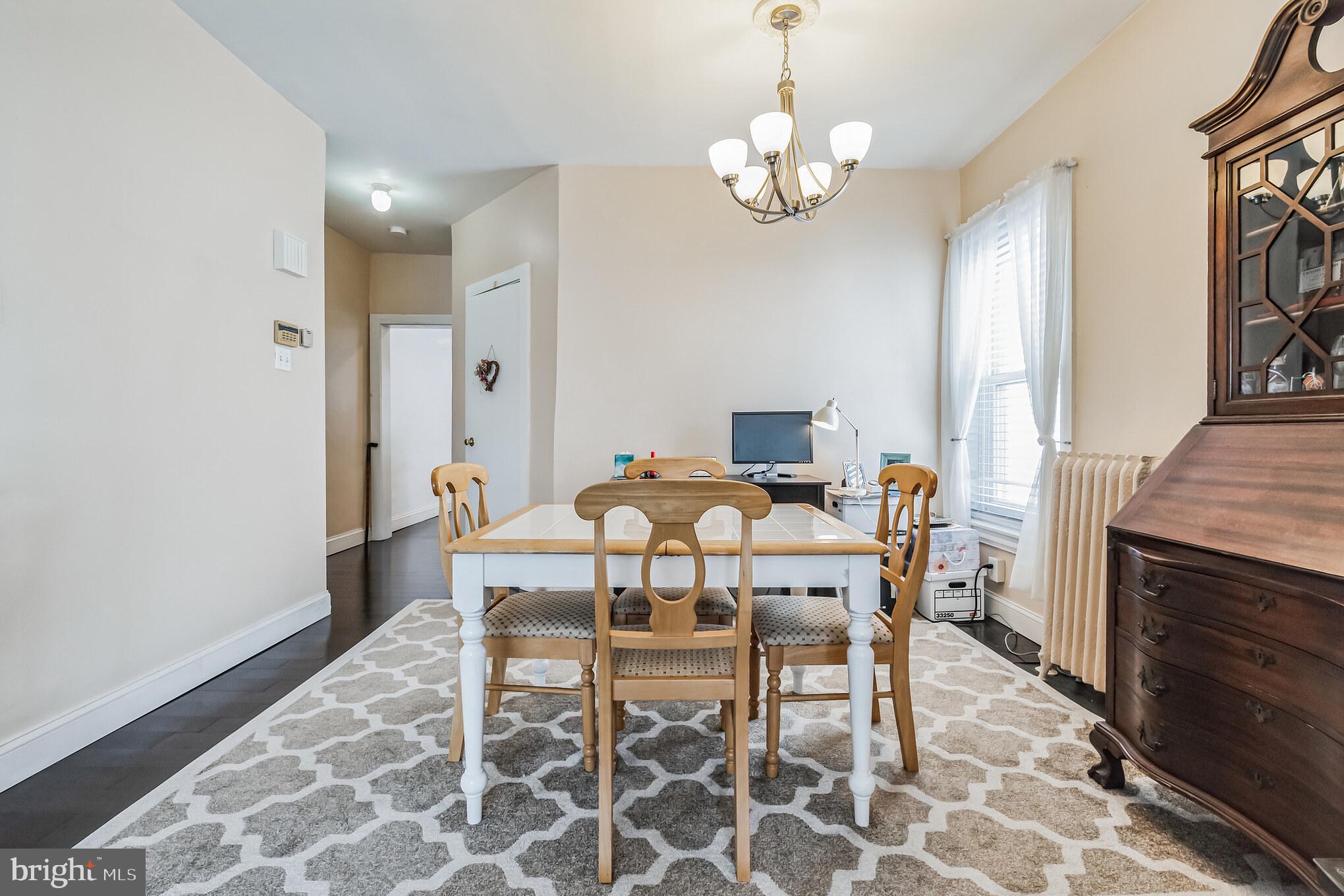 6774 Ridge Avenue, Unit 2 Philadelphia, PA 19128 - Photo 4 of 15 a view of a dining room with furniture