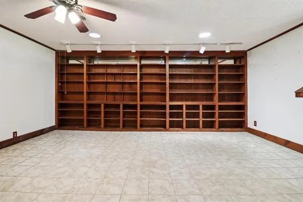 a view of an empty room with a empty space and a large window