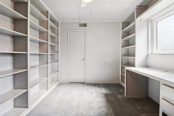 a view of an empty walk in closet