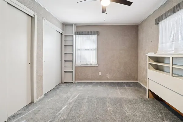 an empty room with a empty space and windows