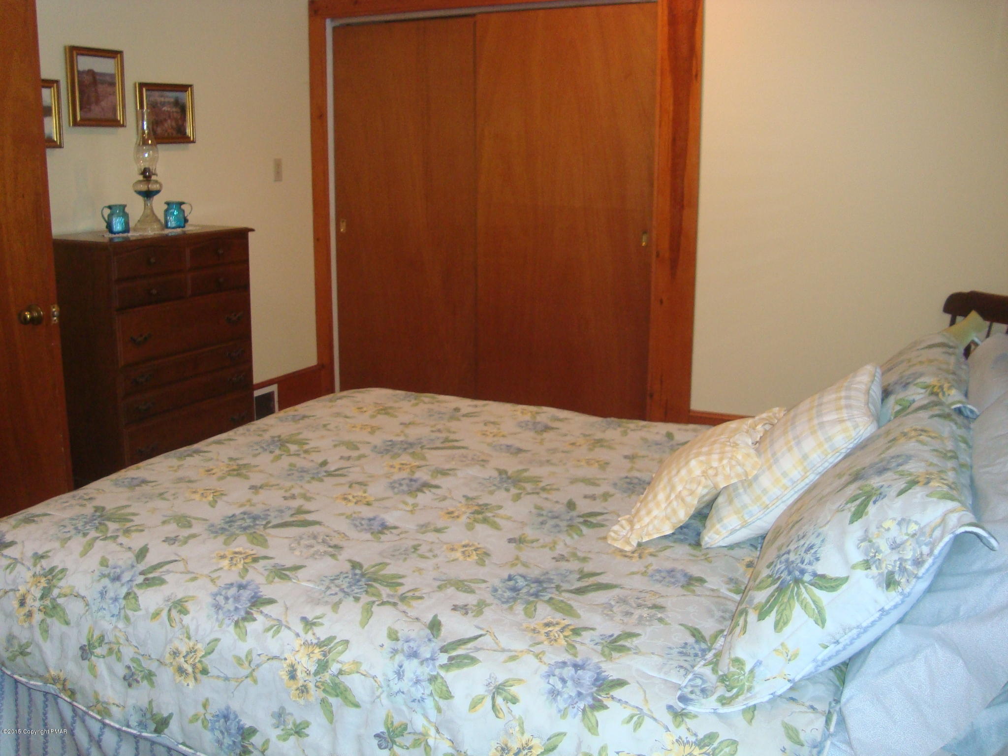 879 Lower Swiftwater Road Cresco, PA 18326 - Photo 33 of 65 a bedroom with a bed and a dresser