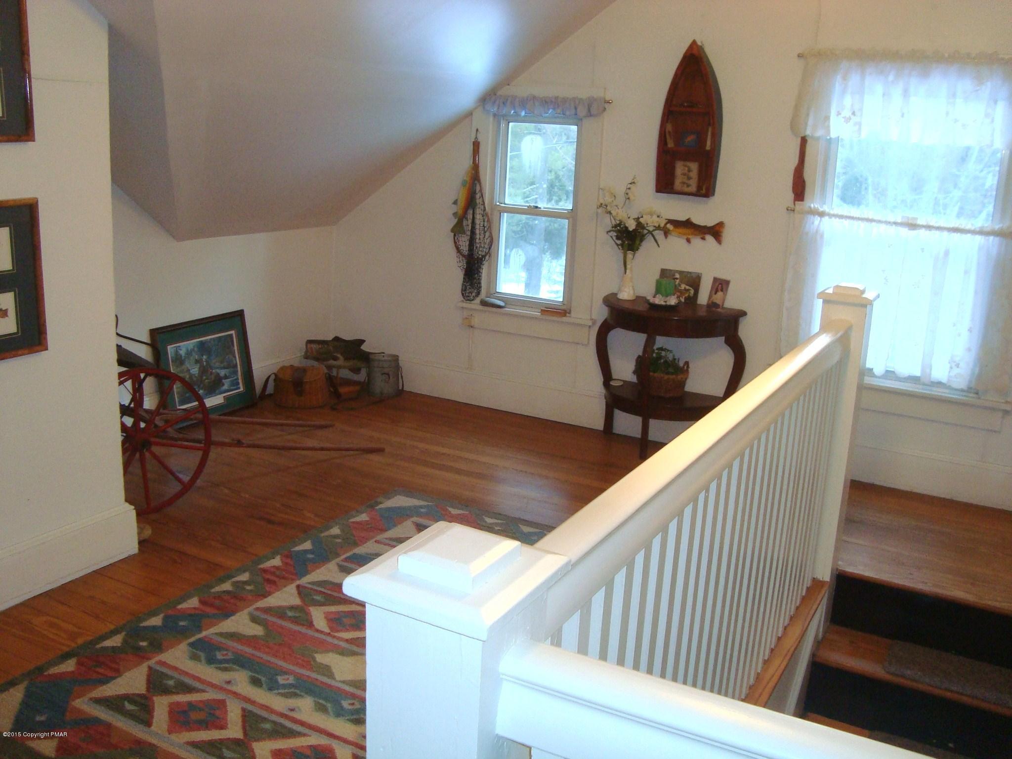 879 Lower Swiftwater Road Cresco, PA 18326 - Photo 58 of 65 a view of a hallway to room with windows