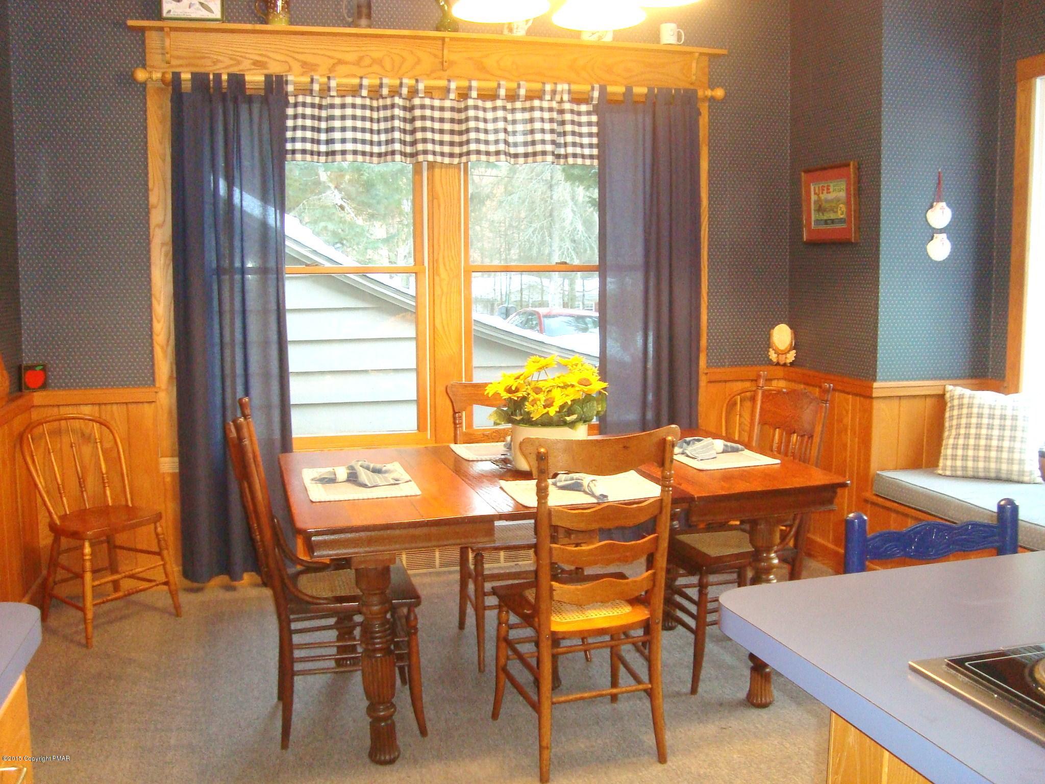 879 Lower Swiftwater Road Cresco, PA 18326 - Photo 7 of 65 a dining room with furniture and wooden floor
