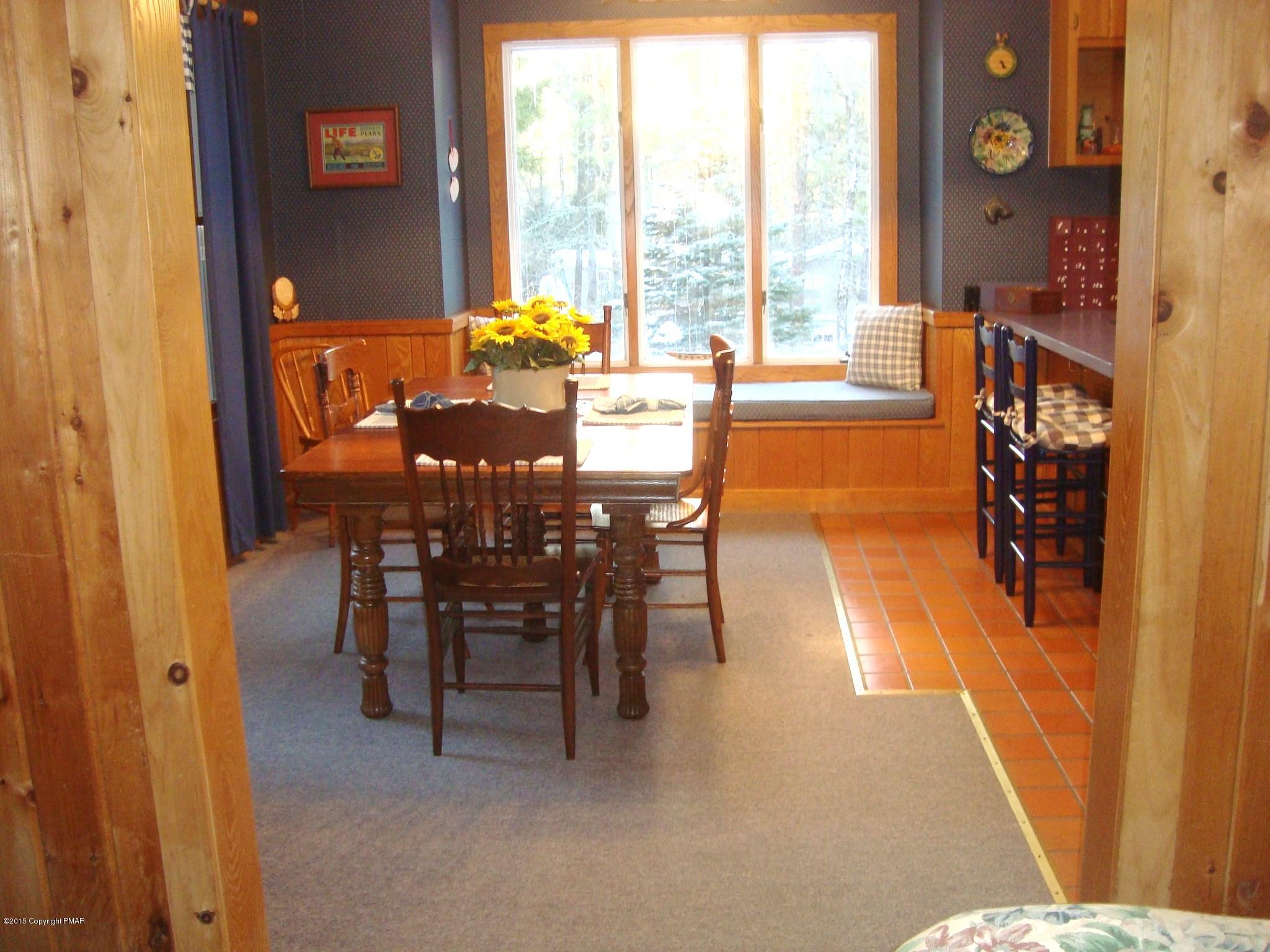 879 Lower Swiftwater Road Cresco, PA 18326 - Photo 8 of 65 a dining room with furniture and wooden floor