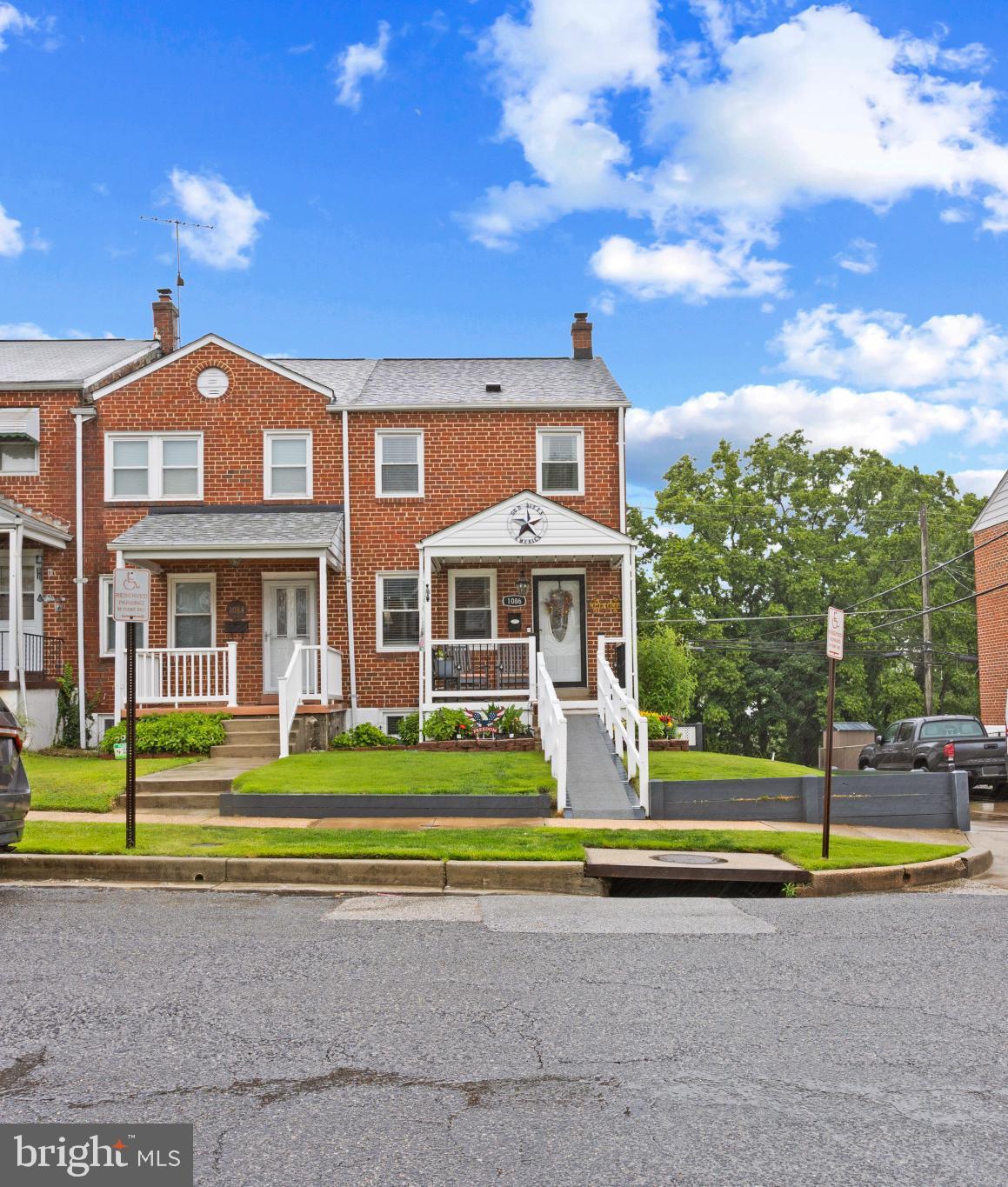 1086 Elm Road Baltimore, MD 21227 - Photo 1 of 35 a front view of a house with a yard