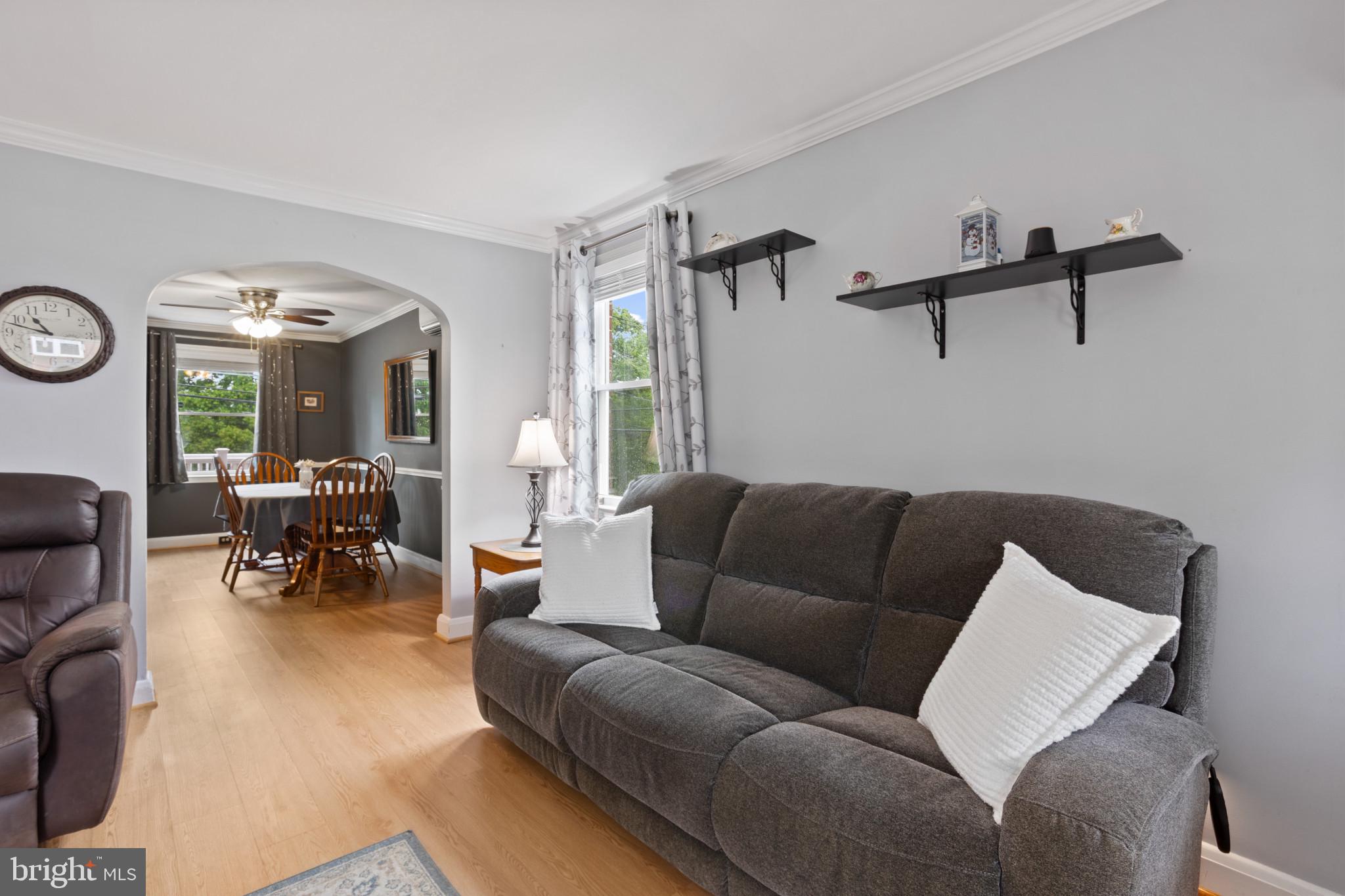 1086 Elm Road Baltimore, MD 21227 - Photo 6 of 35 a living room with furniture and a large window