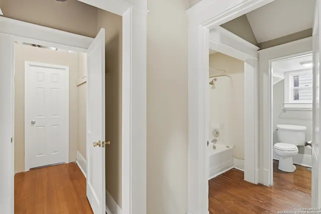 a bathroom with a toilet and a bathtub