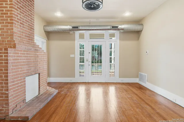 a view of entryway with wooden floor