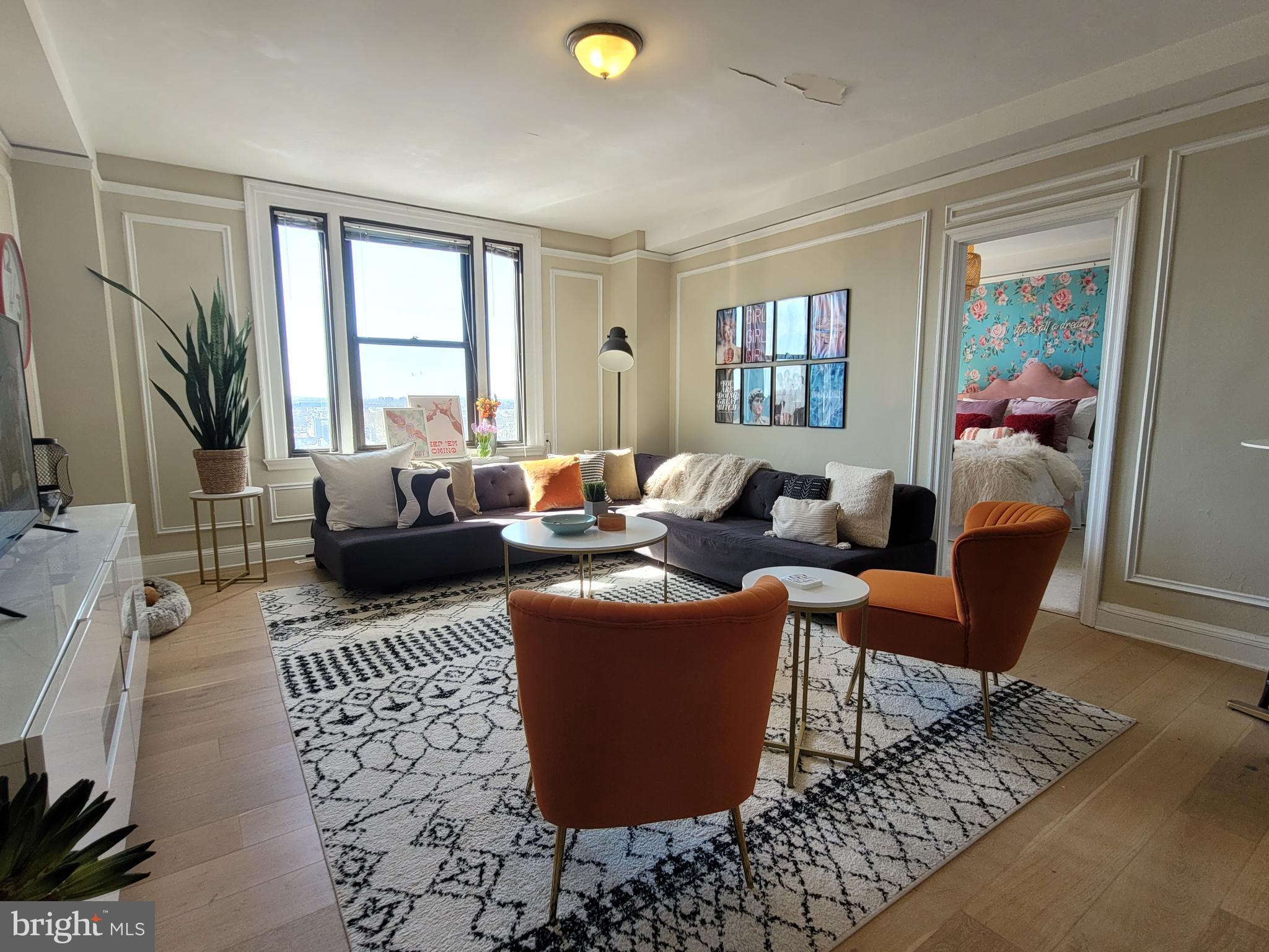 2031 Locust Street, Unit 802 Philadelphia, PA 19103 - Photo 3 of 26 a living room with furniture and a window
