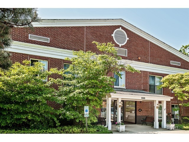 a view of a building with a tree