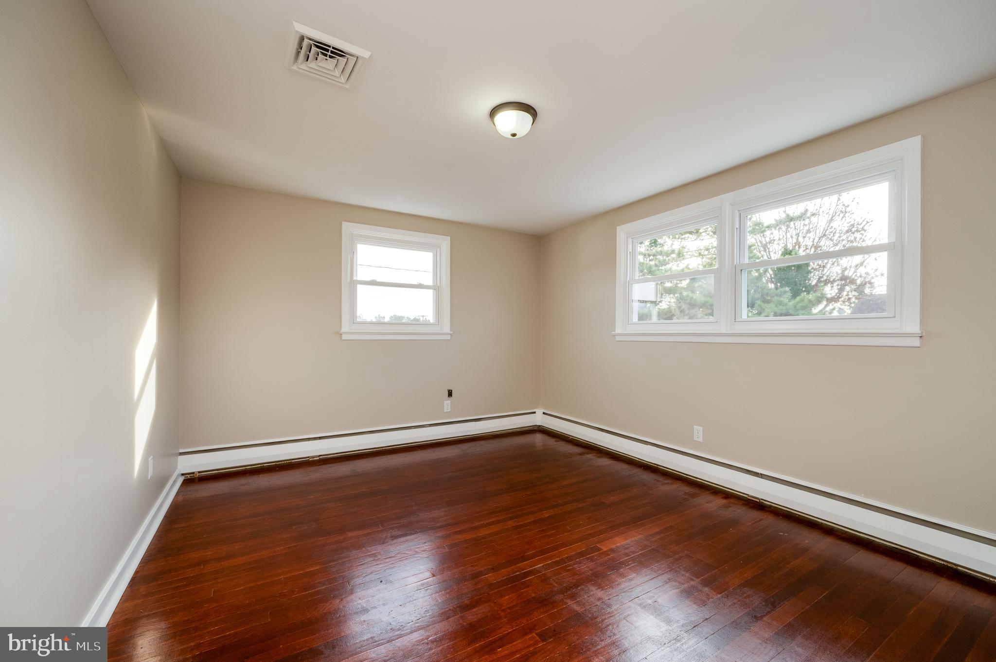 3346 Sheidy Avenue Reading, PA 19605 - Photo 13 of 35 wooden floor in an empty room with a window