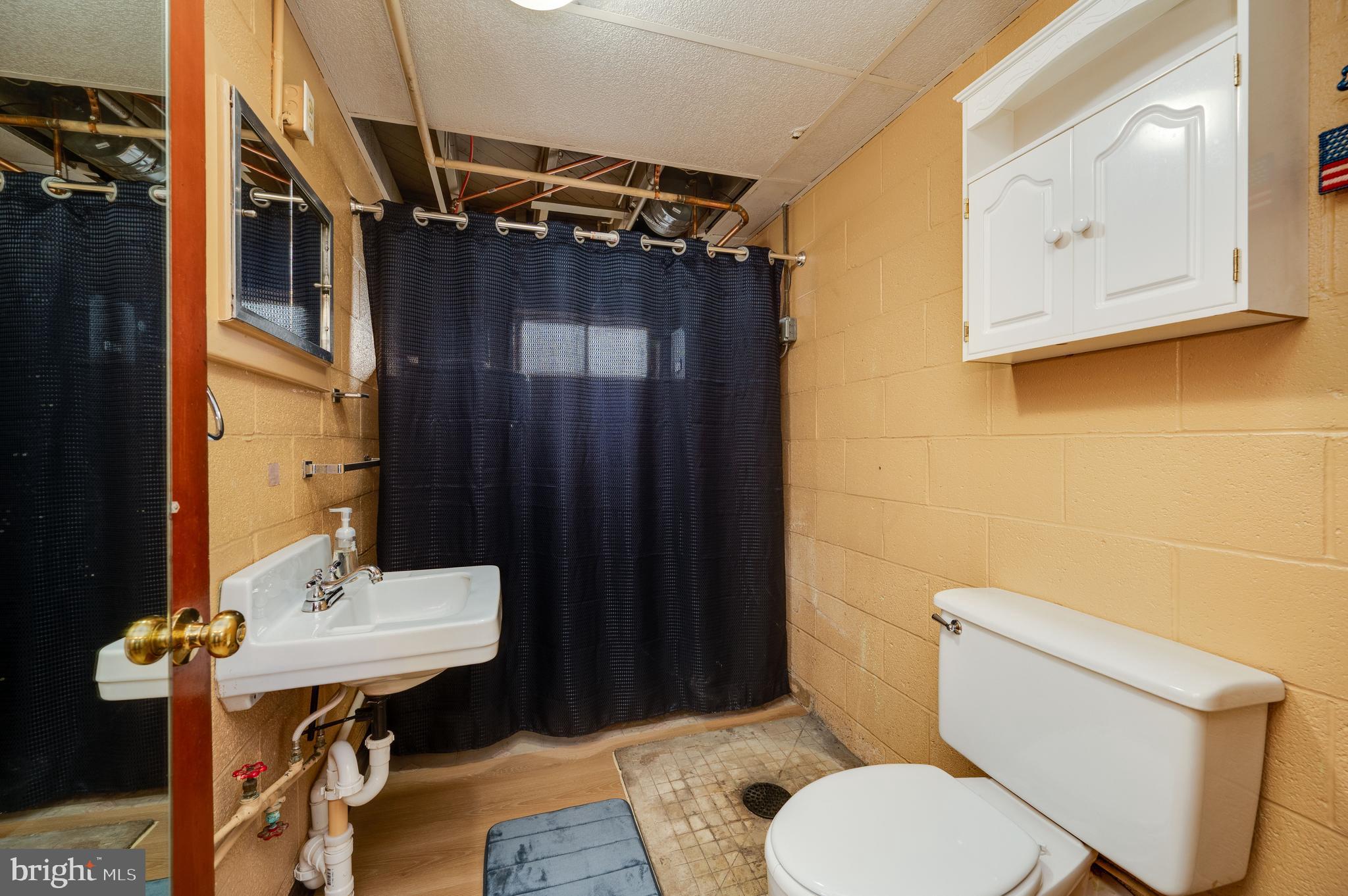 3346 Sheidy Avenue Reading, PA 19605 - Photo 24 of 35 a bathroom with a sink a toilet and shower