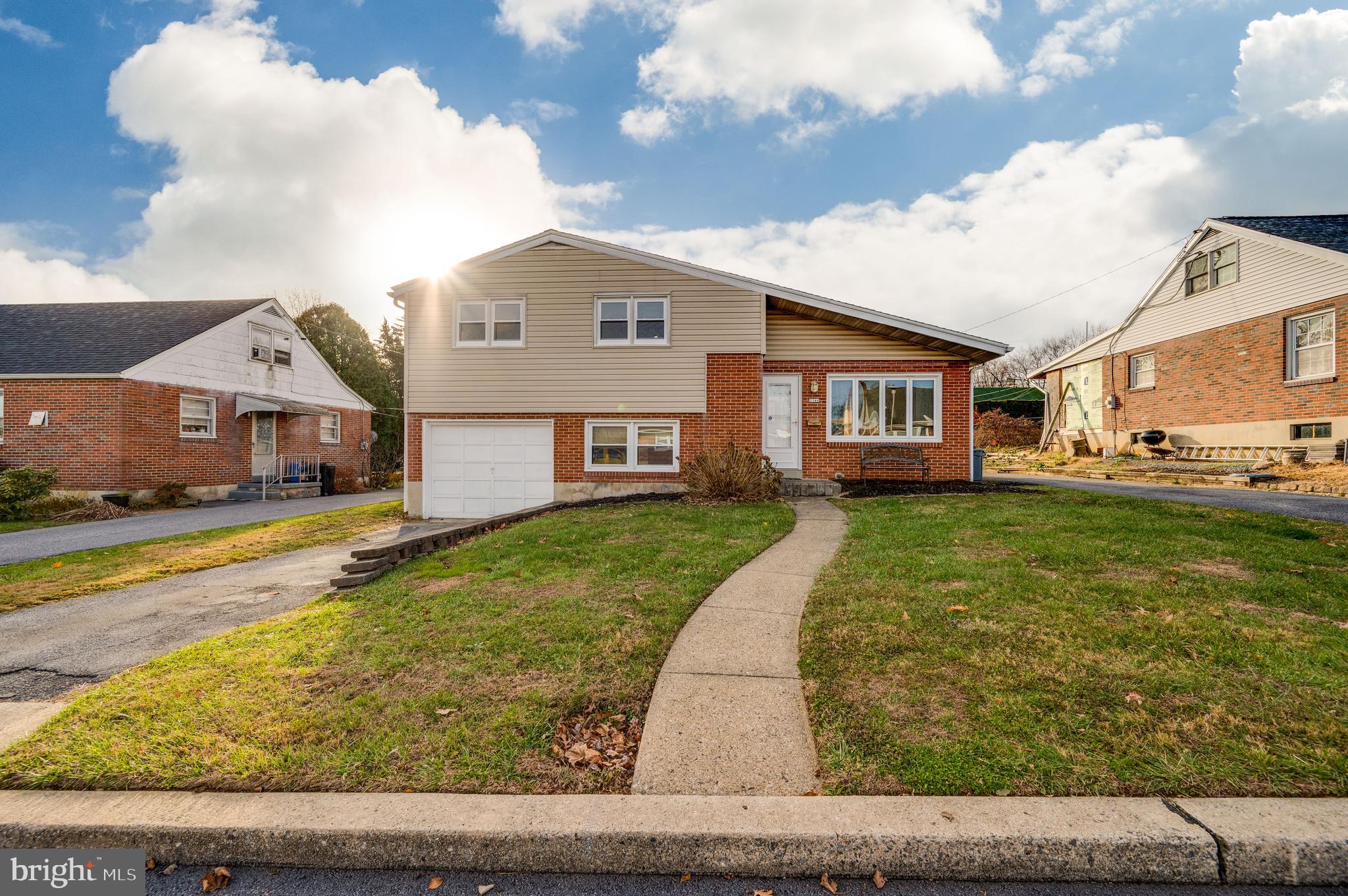 3346 Sheidy Avenue Reading, PA 19605 - Photo 3 of 35 a front view of a house with a yard