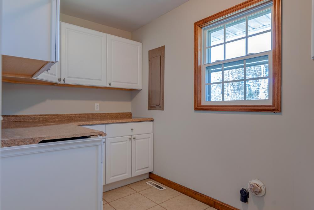 72 Denson Road Lawrenceburg, TN 38464 - Photo 14 of 30 Back down stairs, and down the hallway is this great utility room - look at all the cabinets!