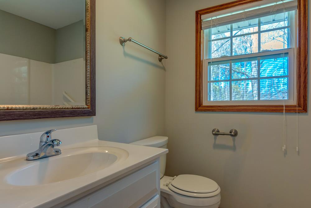72 Denson Road Lawrenceburg, TN 38464 - Photo 21 of 30 This full bath is right off the living room, down the hall from the bedrooms. There's a linen closet in the hall as well.
