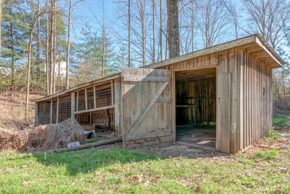 72 Denson Road Lawrenceburg, TN 38464 - Photo 29 of 30 There's even more storage in this 40x10 implement barn, this lies to the right of the home. Perfect for the riding mower or a kennel - or bring the chickens!