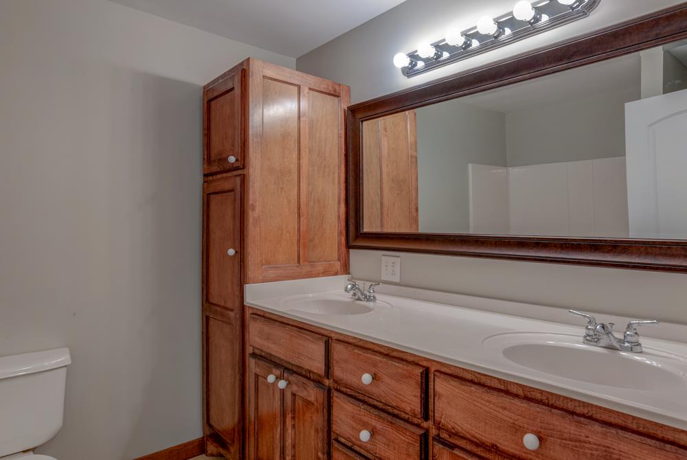 72 Denson Road Lawrenceburg, TN 38464 - Photo 8 of 30 Ample cabinet space is provided in the bathroom up that is shared by the master and one of the secondary bedrooms.