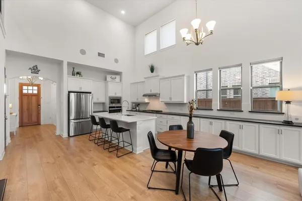 a kitchen with stainless steel appliances granite countertop a sink and cabinets