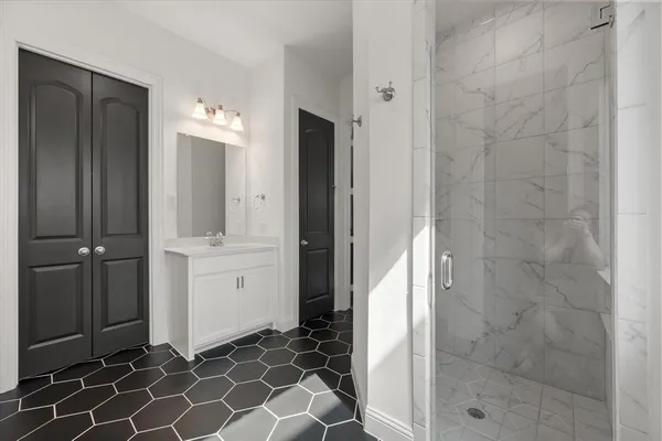 a bathroom with a double vanity sink mirror and