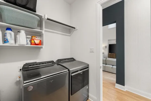 a bathroom with a shower and a sink