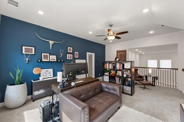 a bathroom with a granite countertop toilet and a sink