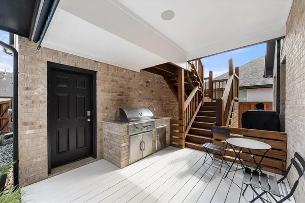 a bathroom with a granite countertop sink a toilet and shower