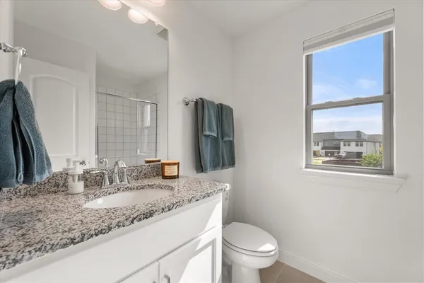 a bedroom with a bed and a cabinets