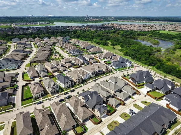 a bathroom with a granite countertop sink toilet and mirror