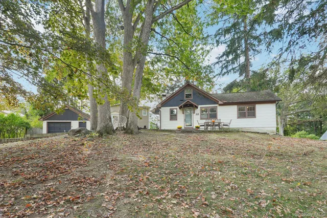 a house with trees in the background