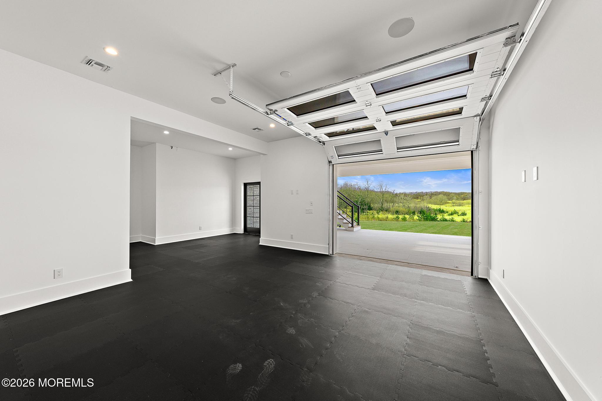 2130 Shadow Lane Wall, NJ 07719 - Photo 69 of 77 Lower Level Gym w. Garage Door