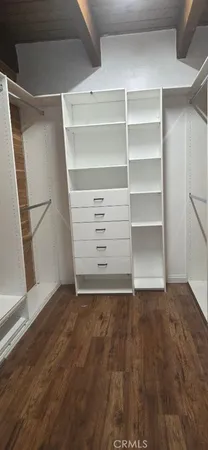a view of an empty walk in closet