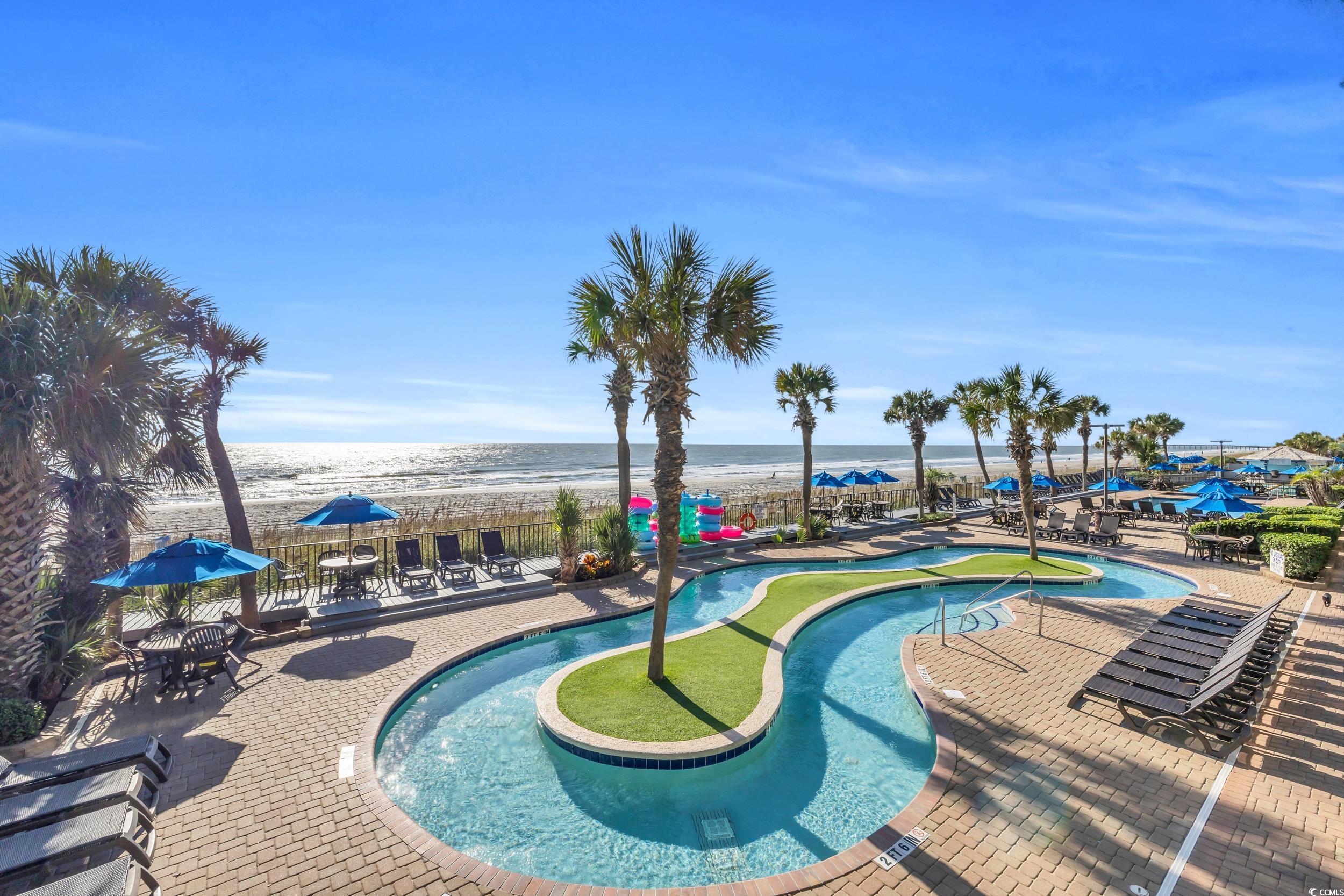 2401 South Ocean Boulevard, Unit 659 Myrtle Beach, SC 29577 - Photo 29 of 38 Community pool featuring a patio, a water view, and outdoor dining area