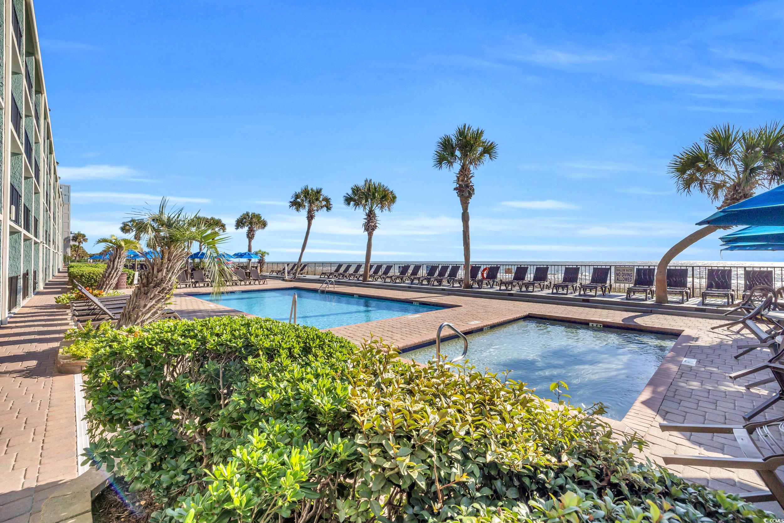 2401 South Ocean Boulevard, Unit 659 Myrtle Beach, SC 29577 - Photo 34 of 38 Community pool featuring a patio area
