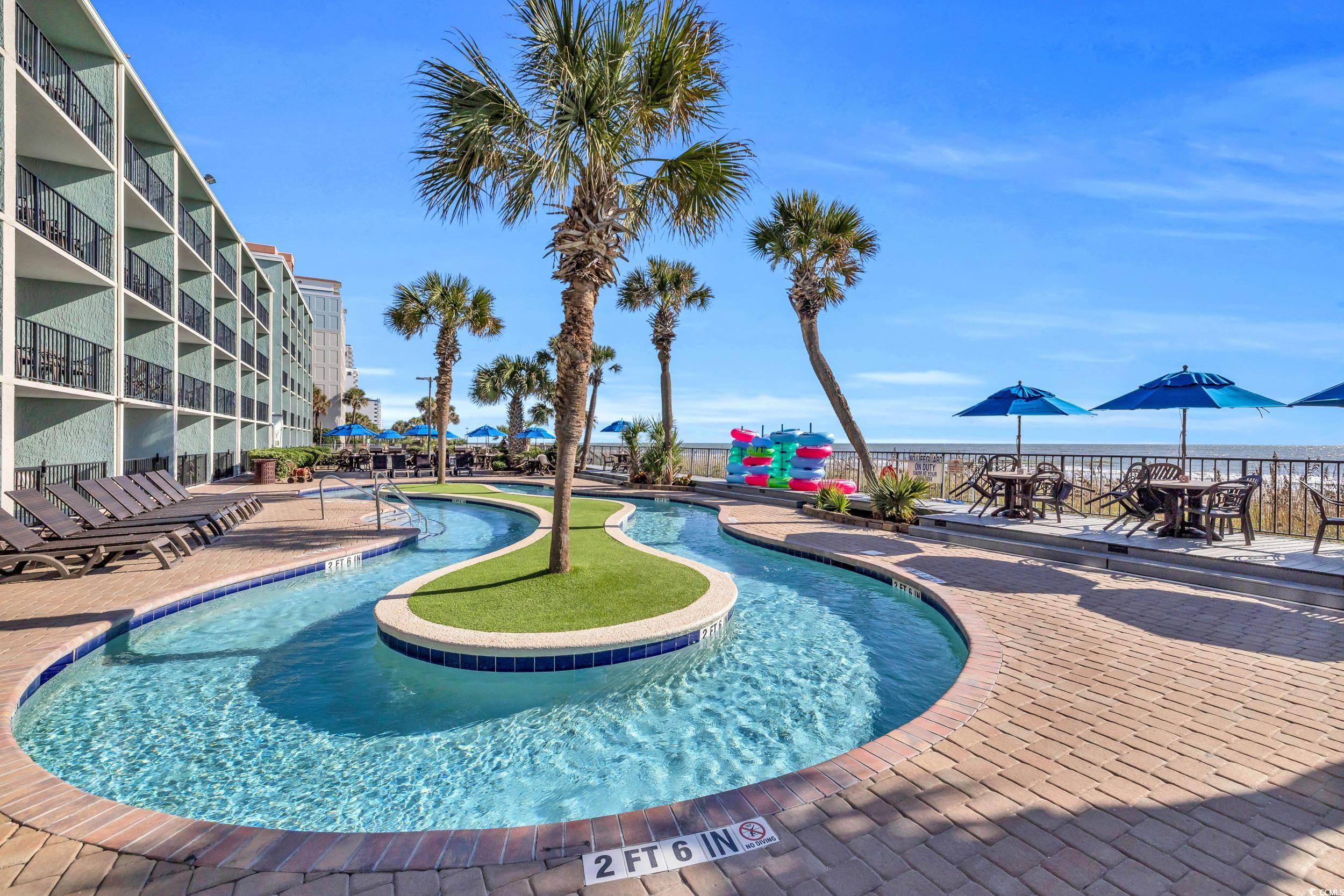 2401 South Ocean Boulevard, Unit 659 Myrtle Beach, SC 29577 - Photo 36 of 38 Community pool featuring a patio