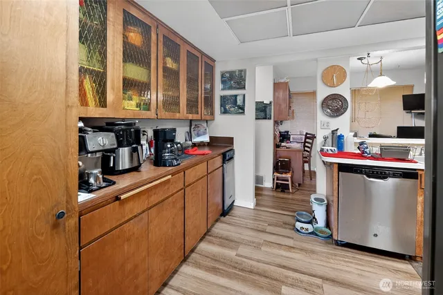 a kitchen with stainless steel appliances granite countertop a stove and cabinets