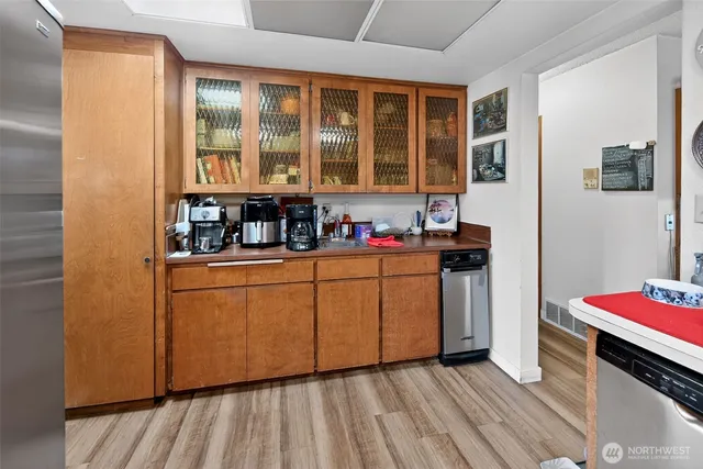 a kitchen with sink and cabinets