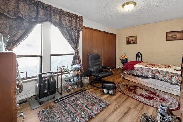 a bedroom with furniture and a window