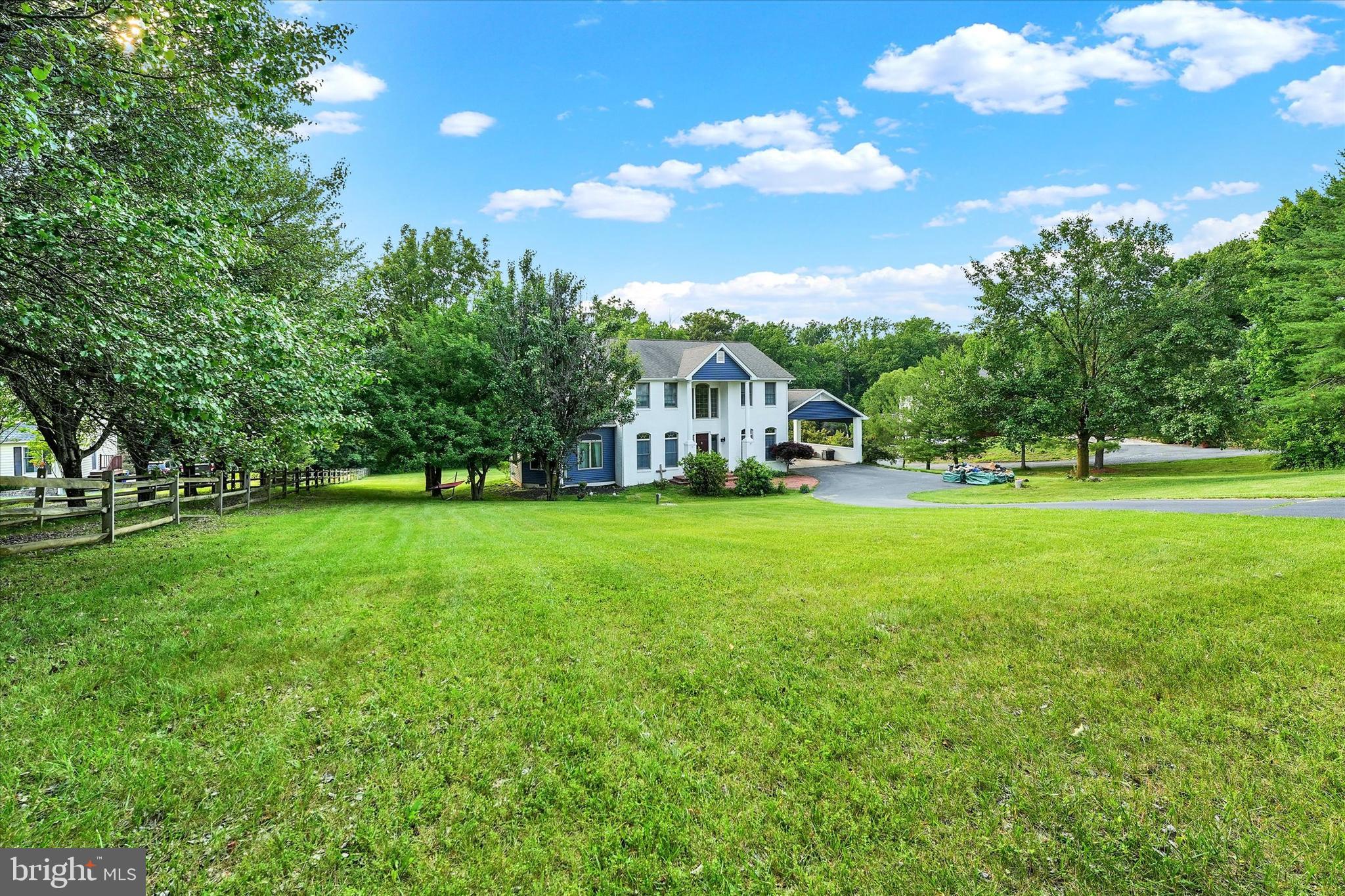 177 Pearce Creek Drive Earleville, MD 21919 - Photo 1 of 37 a view of house with garden space and trees