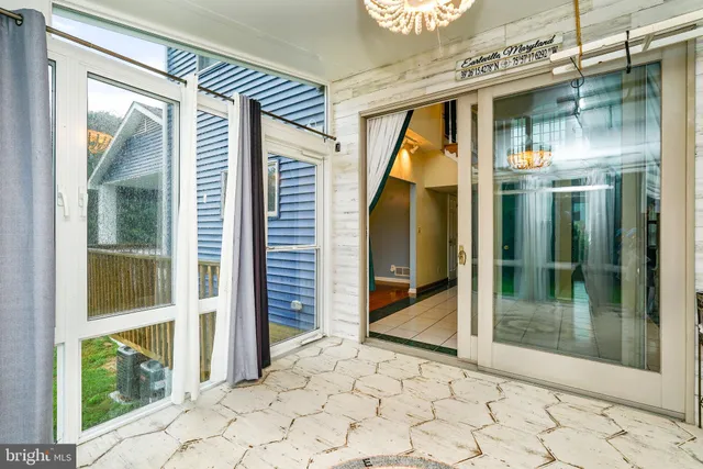 a view of an entryway with wooden floor