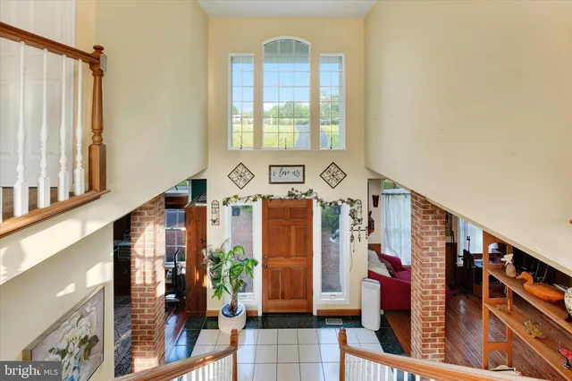 a view of an entryway with wooden floor and door