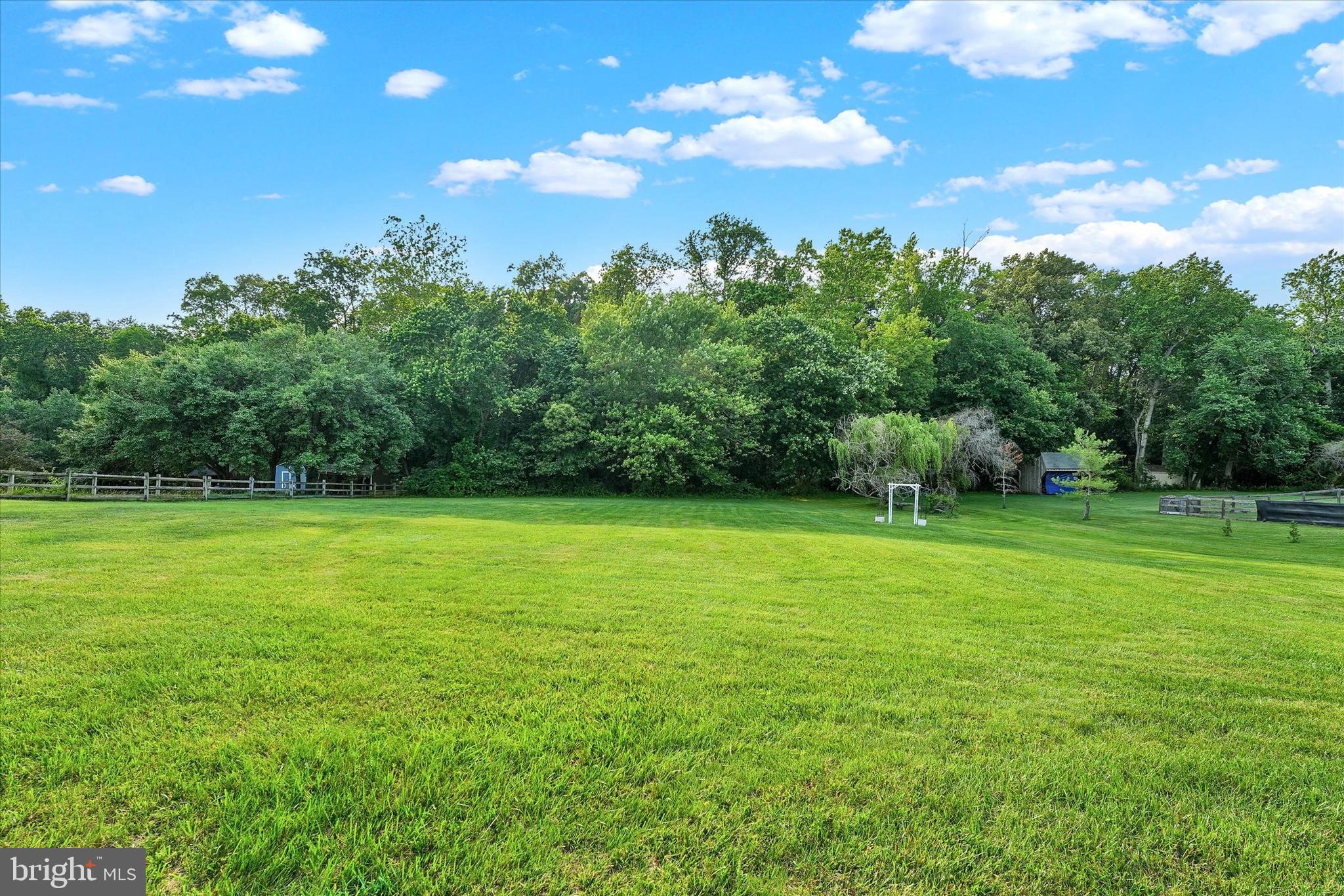 177 Pearce Creek Drive Earleville, MD 21919 - Photo 31 of 37 a view of a field of grass and trees