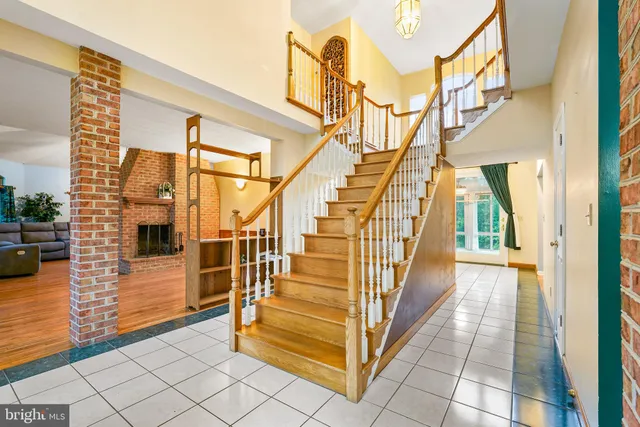 a view of livingroom with dining room and hardwood floor