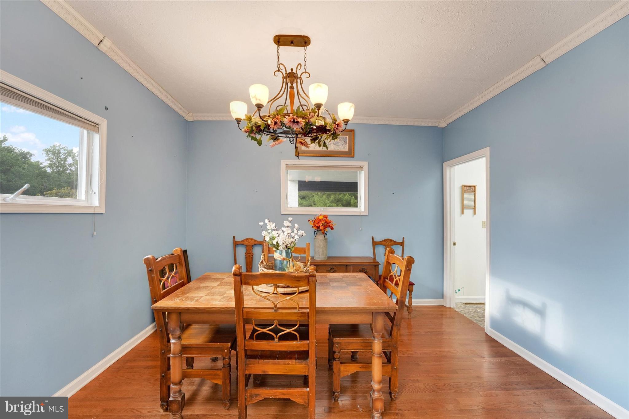 177 Pearce Creek Drive Earleville, MD 21919 - Photo 4 of 37 a dining room with furniture a chandelier and window