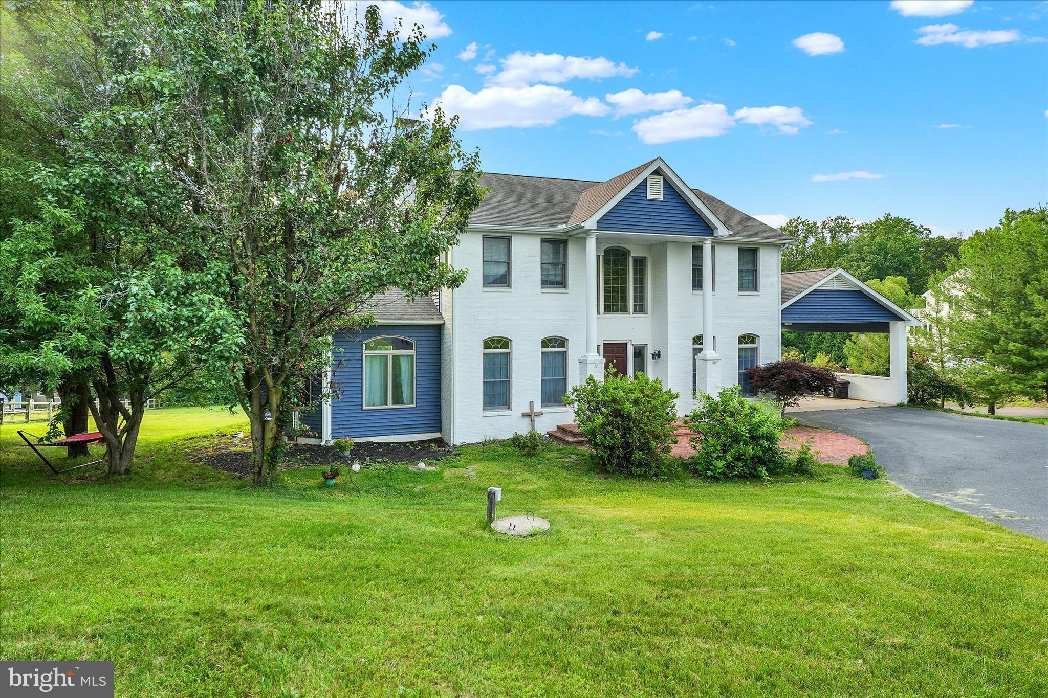 177 Pearce Creek Drive Earleville, MD 21919 - Photo 5 of 37 a front view of a house with a yard and trees